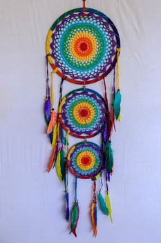 Beautiful multicolored handmade dreamcatcher on white background.