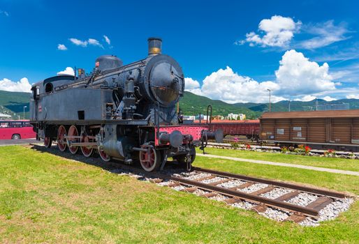 Nova Gorica (Gorizia) - June 2016, Slovenia: Old steam locomotive on rails against the blue sky, the landmark is situated in the city of Nova Gorica, close to the Slovenian Italian border