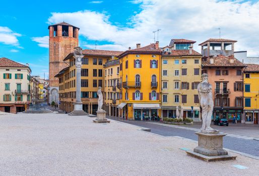 Udine - March of 2016, Italy: Old historical statues and colored houses in traditional architecture style on the Central Square of Liberty in Udine (Piazza della Liberta)