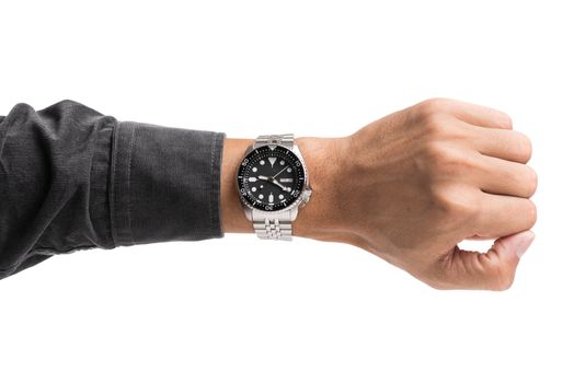 luxury watch on man's wrist over white background