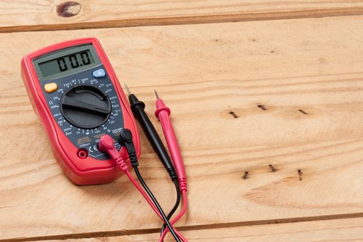 digital multimeter or multitester or Volt-Ohm meter, an electronic measuring instrument that combines several measurement functions in one unit.