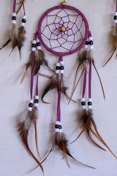 Macro view of real native dream catcher details on pure white background.
