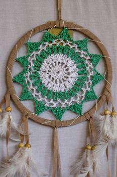 Beautiful green dream catcher on white background.