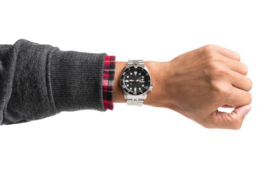 luxury watch on man's wrist over white background