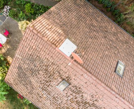 Examination of the roof of a house with a drone, aerial photograph, from the roof of a detached house, Germany