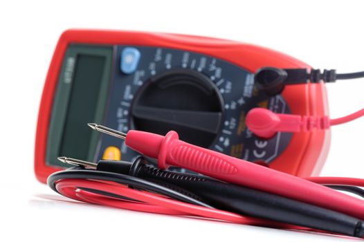 digital multimeter or multitester or Volt-Ohm meter (closeup at test leads), an electronic measuring instrument that combines several measurement functions in one unit.