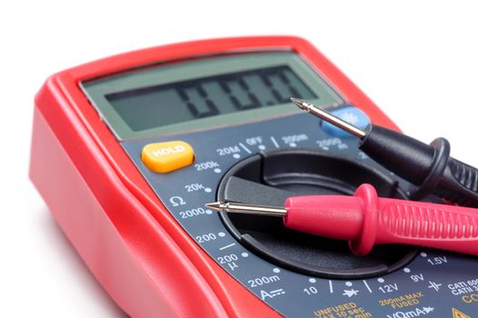 digital multimeter or multitester or Volt-Ohm meter (closeup at test leads), an electronic measuring instrument that combines several measurement functions in one unit.