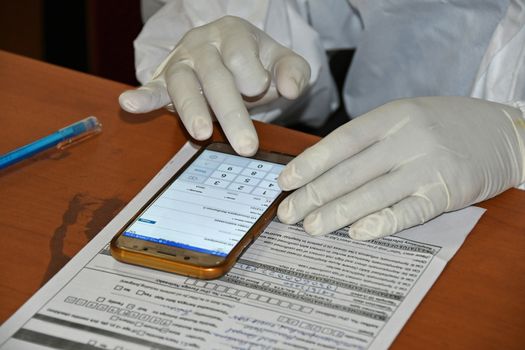 Burdwan Town, Purba Bardhaman District, West Bengal / India - 24.06.2020: Health workers are collecting samples of asymptomatic journalist for COVID-19 (Novel Coronavirus) test in the initiative of Purba Bardhaman District Health Department.