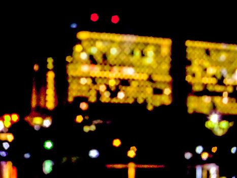 blur night light of building and reflect light on the sea surface in halloween festival