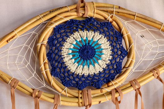 god eye of providence dreamcatcher with white feathers on a white background.