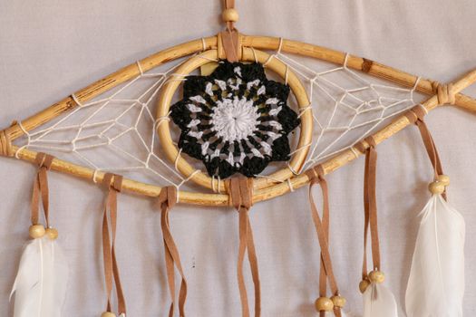 god eye of providence dreamcatcher with white feathers on a white background.