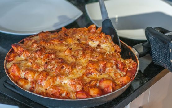 pasta cheese and passata in a pan