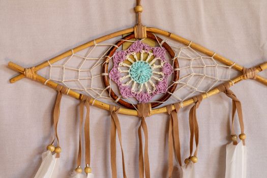 god eye of providence dreamcatcher with white feathers on a white background.