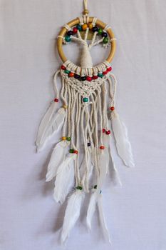 White dreamcatcher - Indian amulet that protects the sleeper from evil spirits and diseases.. The tree - symbol of life. White background.