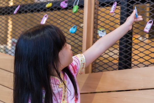 A little cute girl is playing and learning new things she never knew before.