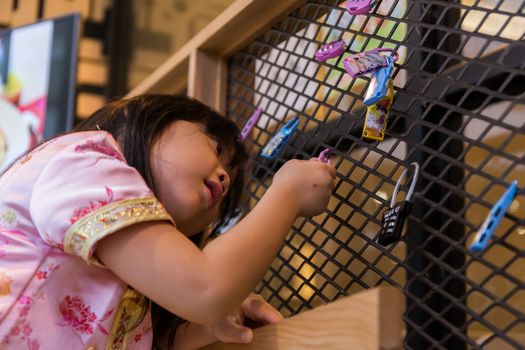 A little cute girl is playing and learning new things she never knew before.