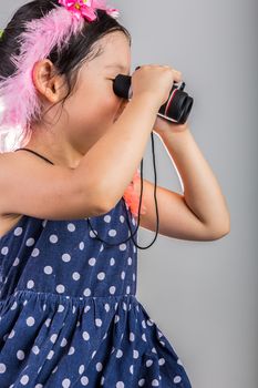 Background of Asian child using binoculars.