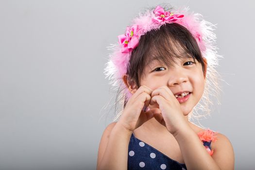 Background of Asian girl holding flowers in her hands.