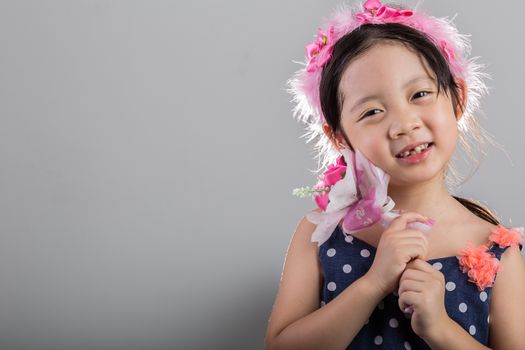 Background of Asian girl holding flowers in her hands.