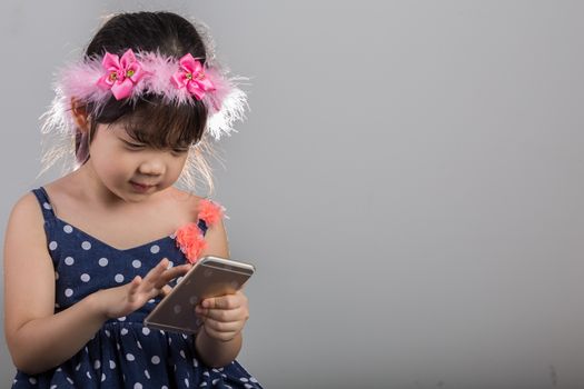 Background of Asian child is using smartphone.