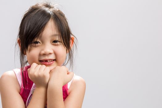 Cute Asian girl smiling, studio isolated white background.