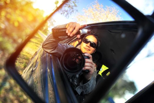 Close up of a handsome man siting in his car in Travel Trip