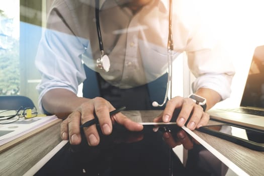 Medicine doctor hand working with modern computer interface and digital tablet computer as medical network concept