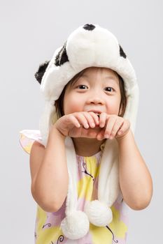 Pretty Asian girl pretending to be animal, panda, studio isolated white background.