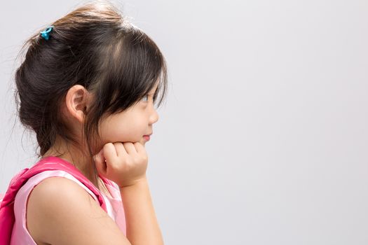 Cute Asian girl thinking, studio isolated white background.