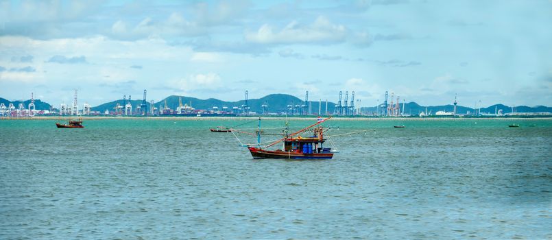 Panorama fishing boat sailing on the sea and industry background