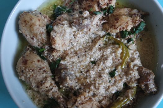 Homemade chicken qorma or white qorma dish. Traditional dish for parties and ceremonial purpose popular in South Asian countries like Pakistan, India and Bangladesh