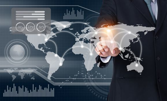 Businessman touching world map and graph on screen with his finger, Elements of this image furnished by NASA