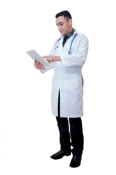 Doctor holding a tablet computer while using it isolated on white background