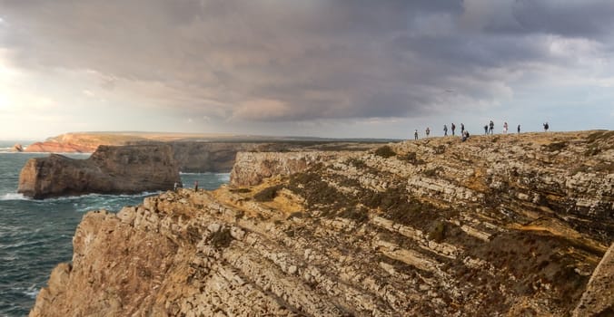 Panoramic view of the Algarve ocean cliffs, Portugal, with dramatic sky