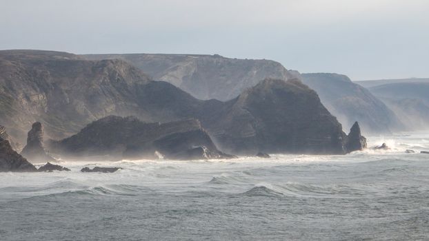 Panoramic view of the Algarve ocean cliffs, Portugal, the long coastline in the morning with a dramatic dreamlike atmosphere