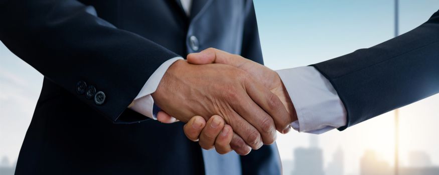 successful negotiate and handshake concept, two businessman shake hand with partner to celebration partnership and teamwork, business deal