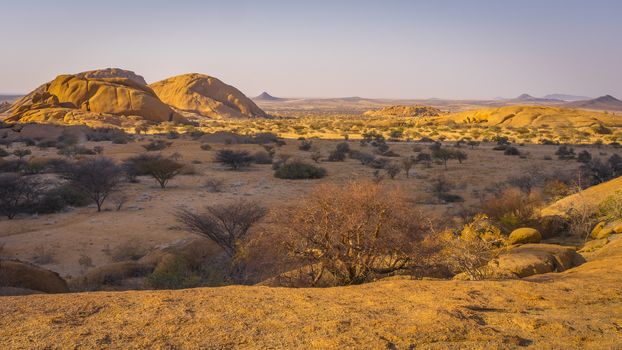 The Pondoks near the Spitzkoppe mountain at sunset in Namibia in Africa.
