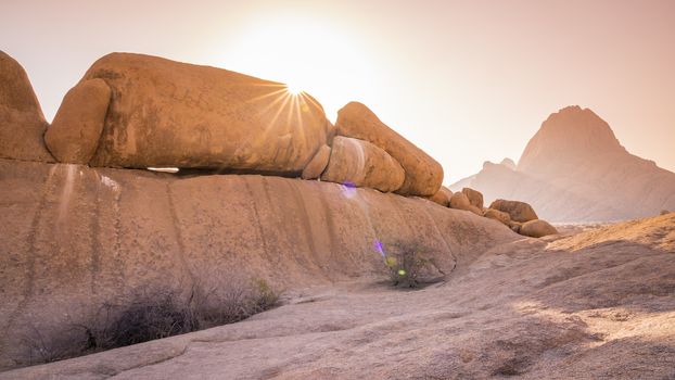 The Spitzkoppe mountain at sunset in Namibia in Africa.