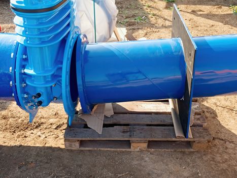 500mm big new drink water Gate valve joint with screws and nuts to pipe fitting. Piping repair, unit on wooden pallet, fasteners and spare parts .