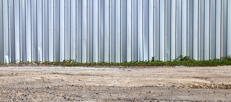 Fence zinc, Fence wall and ground, Wall Metal, Steel, stainless, zinc wall for background image construction area safety (Selective Focus)