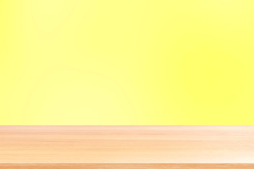 empty wood table floors on gradient yellow soft background, wood table board empty front colorful gradient, wooden plank blank on light yellow gradient for display products or banner advertising