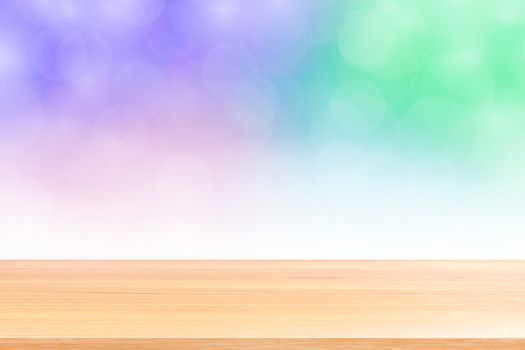 empty wood table floors on blurred bokeh soft purple gradient background, wooden plank empty on purple bokeh colorful light shade, colorful bokeh lights gradient soft for banner advertising products