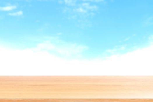 empty wood table floors on blurred blue sky and cloud background, wood table board empty front blur sky blue, wooden plank blank on sky with perspective brown wood table for mock up display products