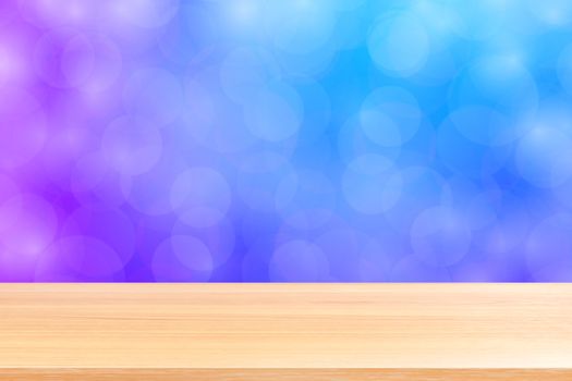 empty wood table floor on blurred bokeh soft purple gradient background, wooden plank empty on purple bokeh colorful light shade, colorful bokeh lights gradient soft for banner advertising products