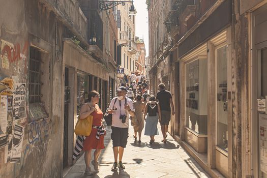 VENICE, ITALY 2 JULY 2020: Tourists walk in Venice street