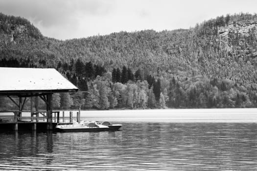 Wooden roof for trip holiday paddle boats. Holiday resort on the shores of beautiful Alpine lake