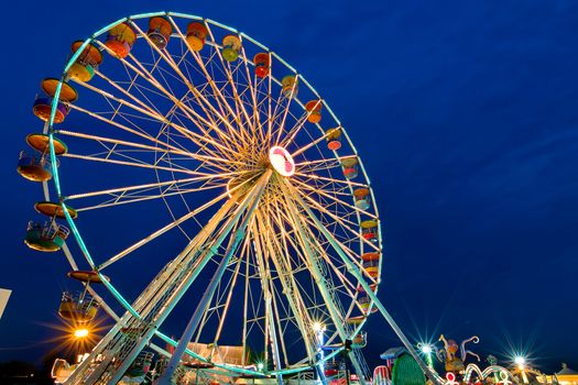 Ferris wheel with outdoor long exposure at twilight.