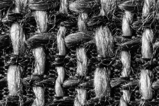 Texture of cloth material for design. Abstract background with white, black and gray threads of woven.