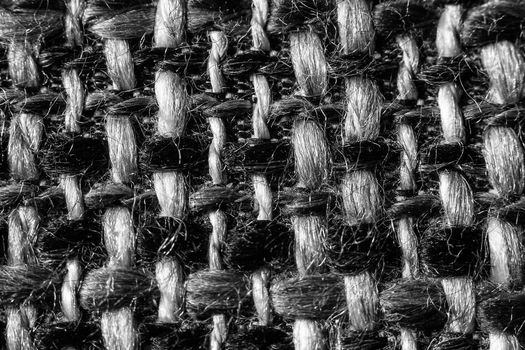 Texture of cloth material for design. Abstract background with white, black and gray threads of woven.