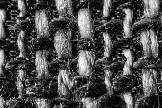 Texture of cloth material for design. Abstract background with white, black and gray threads of woven.